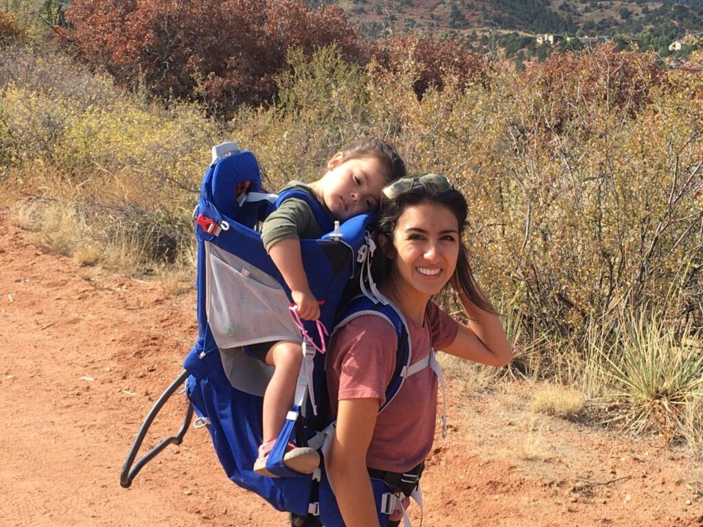 Family using hiking child carrier