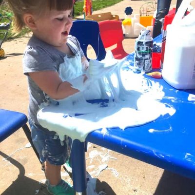 child covered in glue and shaving ceam